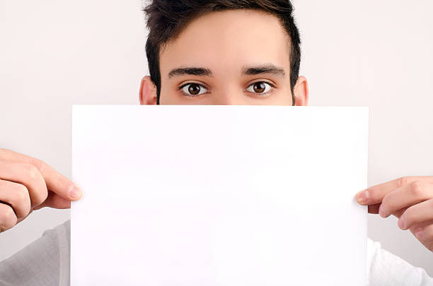 istock Eyes looking over a piece of paper. 178731106