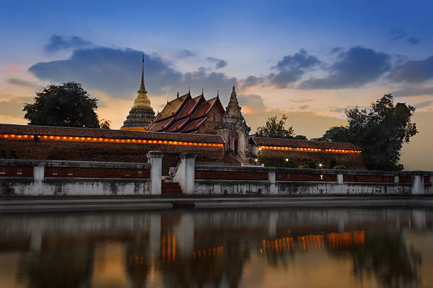 istock wat pra tag lampang loung temple with reflection. 178731364