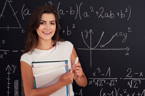 istock Portrait of beautiful student with spiral notebook and chalk 178732774