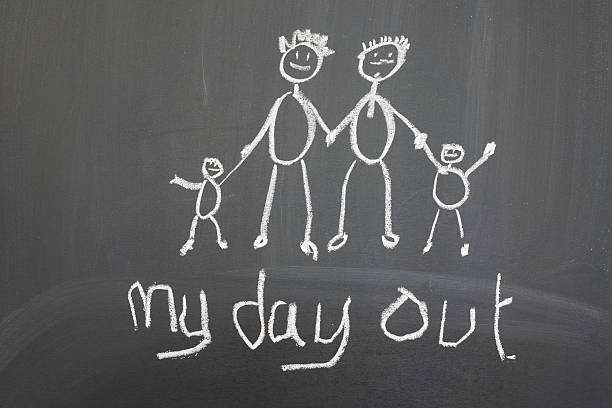 istock Blackboard with a child's drawing of a happy family day out. 178733038
