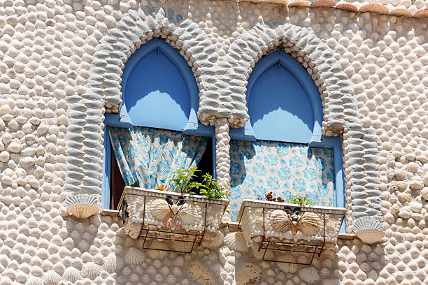 Detail of The House of Shells (La Casa de las Conchas) in Peniscola, Spain. This unusual house has a facade decorated with sea shells and windows in arabic style.