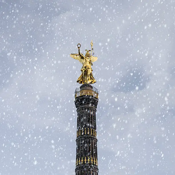 siegessäule in winter with snowflakes
