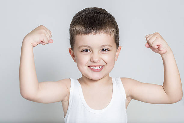 istock Little boy showing muscles 178733296