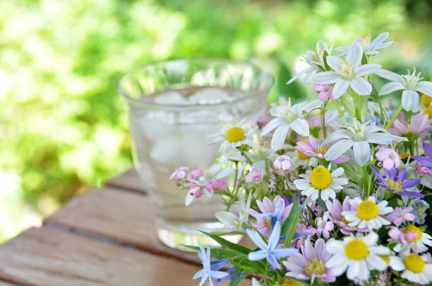 garden flowers with a glass of water