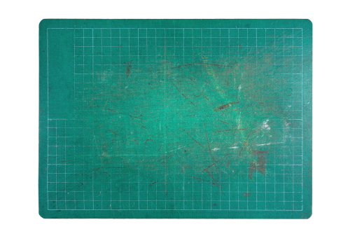 used green cutting mat on white background