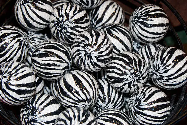 Bucket full of zebra golfballs