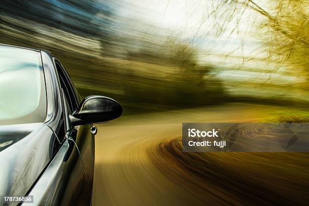 Motion Image Of Black Car Making Turn Stock Photo - Download Image Now - Blurred Motion, Car, Curve