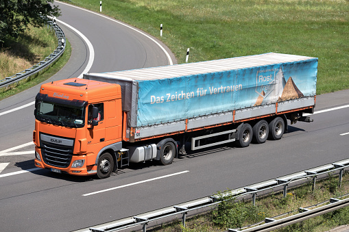 Wiehl, Germany - June 25, 2019: Bialas DAF truck with tarpaulin trailer on motorway