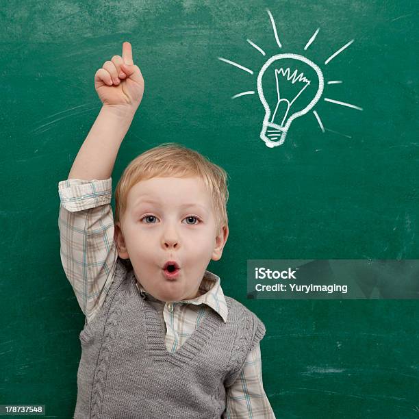 Young Child Under Light Bulb Drawn On Chalkboard Stock Photo - Download Image Now - Beautiful People, Boys, Chalkboard - Visual Aid