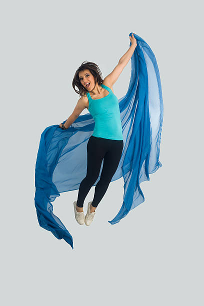 istock Jumping and smiling angel with blue wings - isolated 178737818