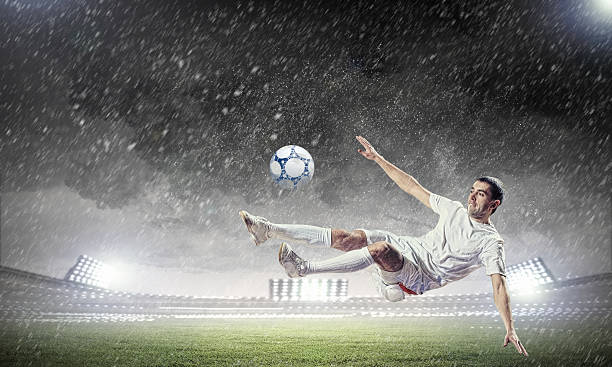 istock football player striking the ball 178738337