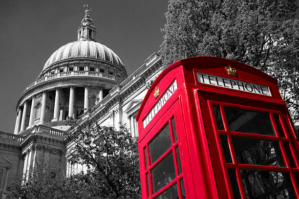 Red telephone booth in London in front of Westminster Abbey in black and white