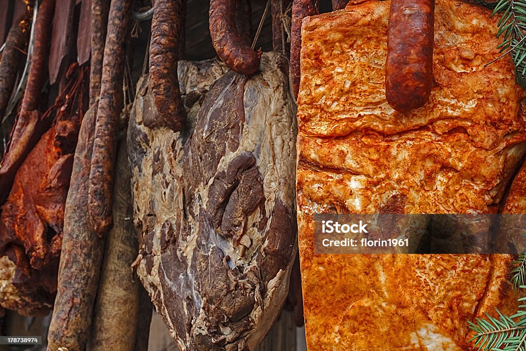 Romanian traditional food Various types of romanian beacon and sausages (carnati), smoked and dried, exposed for sale. Shall specify for the month of December. Bacon Stock Photo