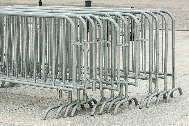 istock Metal barriers separating people at the concert. 178739078
