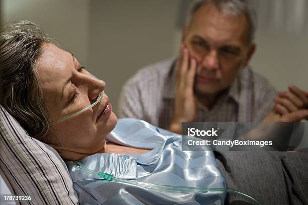 Sick Mature Woman Lying In Bed Stock Photo - Download Image Now - Illness, Husband, Nursing Home