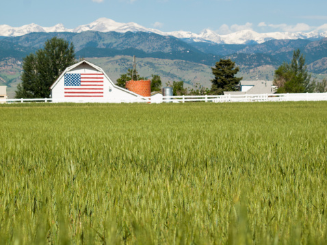 White barn with painted American Flag in Colorado.