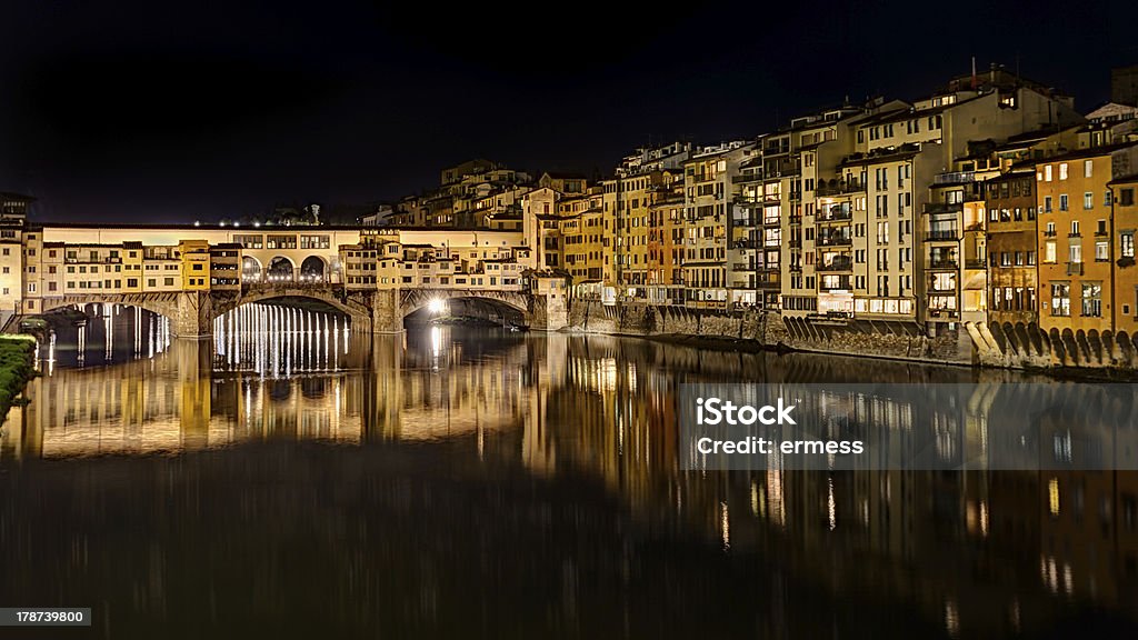 Ponte Vecchio at night in  Florence, Italy landscape at night of Florence, Italy: view of the famous landmark Ponte Vecchio (old bridge), a medieval bridge over the Arno river Ancient Stock Photo