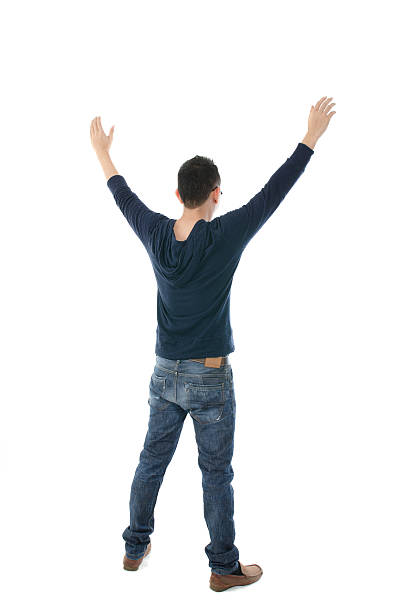 istock south east asian man hands raised from back 178740177
