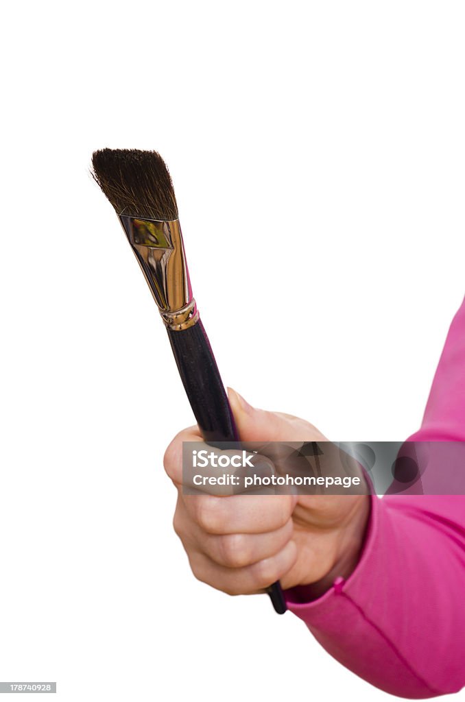 Female hand is holding a brush Female hand is holding a brush for painting Adult Stock Photo