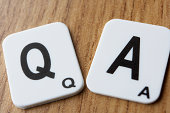 Two scrabble pieces saying Q & A