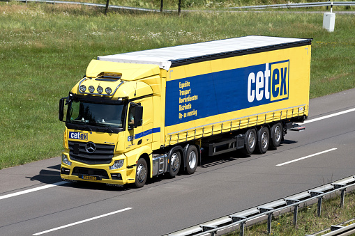 Wiehl, Germany - June 25, 2019: cetex Mercedes-Benz Actros truck with curtainside trailer on motorway