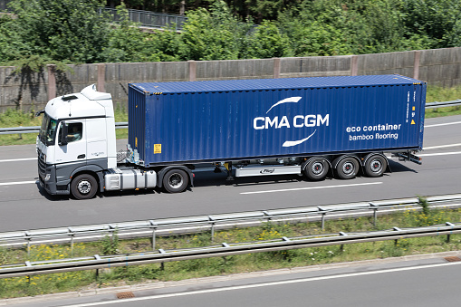 Wiehl, Germany - June 24, 2019: Mercedes-Benz truck with CMA CGM container on motorway