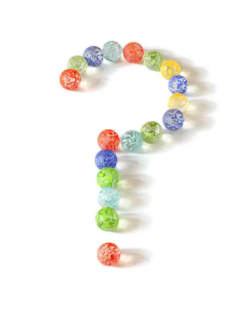 Glass marbles making question mark