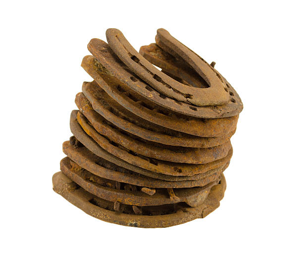 istock stack of old retro horse shoes isolated on white 178741842