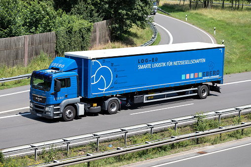 Wiehl, Germany - June 24, 2019: EBERO MAN TGS truck with curtainside trailer on motorway