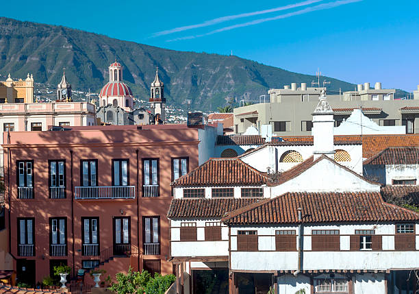 Villa de la Orotava View of the Villa de la Orotava in Tenerife, are their homes and roofs, a church and mountains at the background. mariposa county stock pictures, royalty-free photos & images