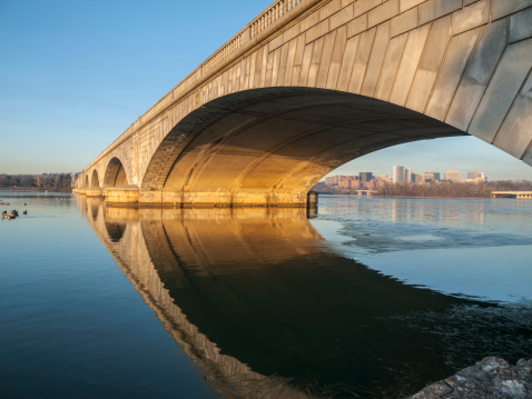 Dawn light on the Arlington bridge and Potomac river in Washington DC, USA.