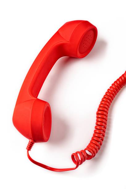 istock Red handset of a vintage phone isolated on white background. Vertical image 1787432396