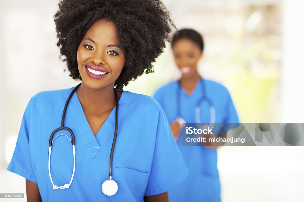 pretty african medical nurse pretty african american medical nurse portrait in office Blue Stock Photo