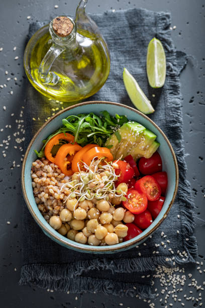 istock Healthy salad with groats, arugula, chickpeas and vegetables. 1787436348