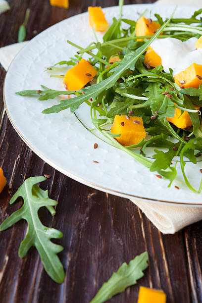 salad with chunks of pumpkin and arugula