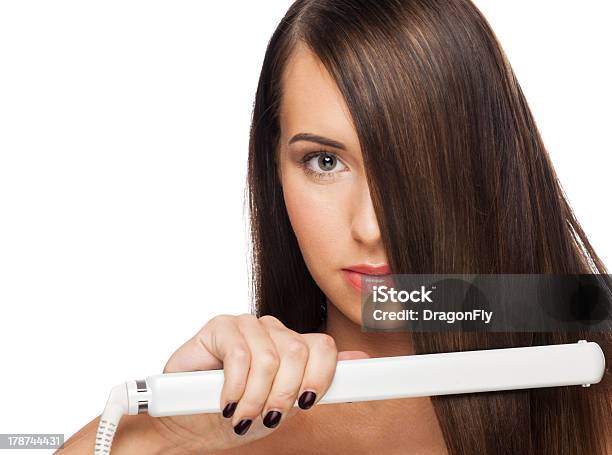 Woman With Hair Straightening Irons Stock Photo - Download Image Now - Iron - Appliance, Women, One Woman Only