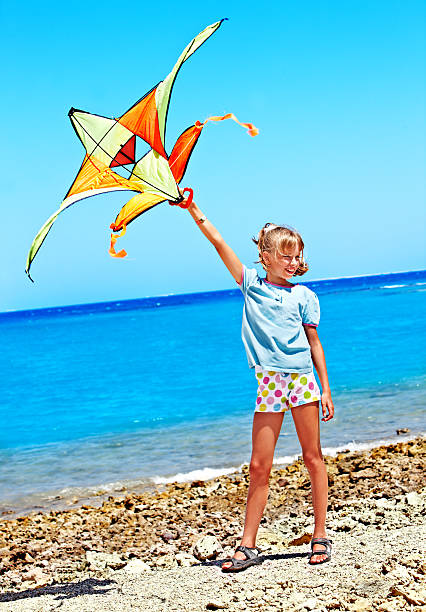 istock Kid flying kite outdoor. 178744774