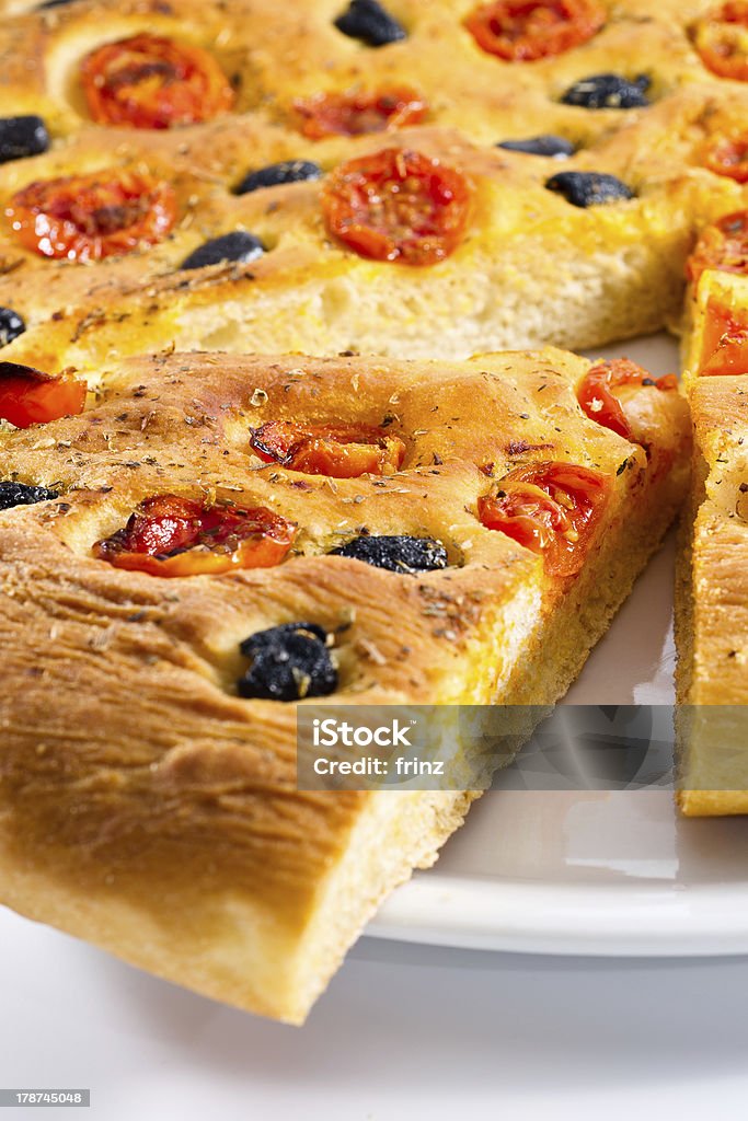 Apulian Focaccia with tomatoes and olives Adult Stock Photo