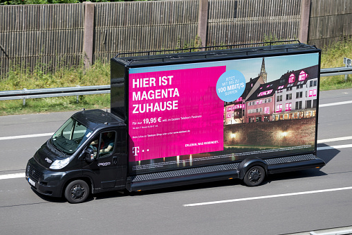 Wiehl, Germany - June 25, 2019: Innovisco CoolLiteTruck with Deutsche Telekom advertising on motorway