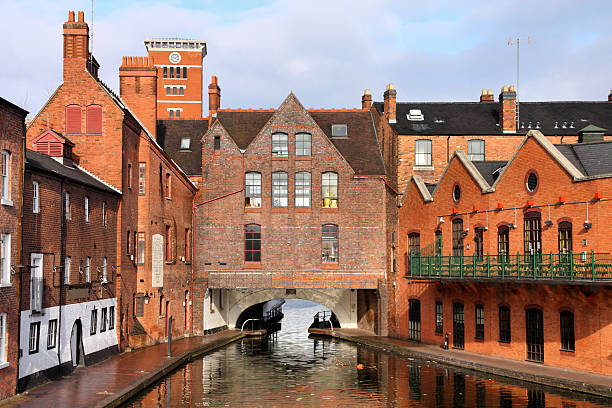 A river view of red brick buildings in Birmingham Birmingham water canal network - famous Gas Street Basin. West Midlands, England. west midlands photos stock pictures, royalty-free photos & images