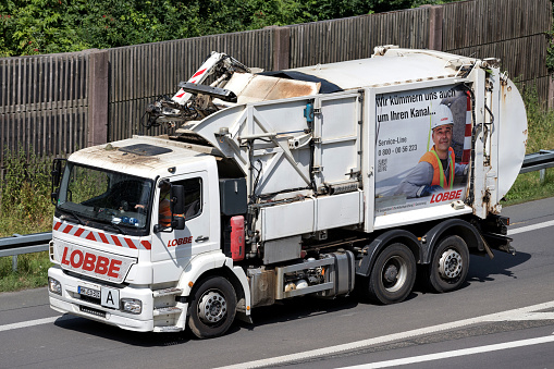 Wiehl, Germany - June 25, 2019: Lobbe dustcart on motorway