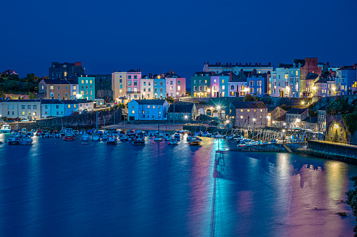 Tenby Harbour, by night with water reflections