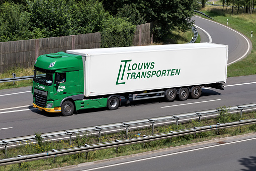 Wiehl, Germany - June 24, 2019: Louws DAF XF truck with box trailer on motorway