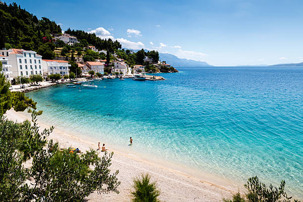 Beautiful Adriatic Beach and Lagoon with Turquoise Water Beautiful Adriatic Beach and Lagoon with Turquoise Water near Split, Croatia split croatia stock pictures, royalty-free photos & images