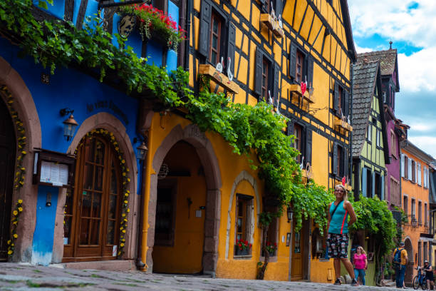 Colorful half timbered building in the streets of the beautiful Alsace village Riquewihr