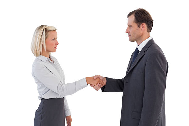 istock Serious business people shaking hands 178747220