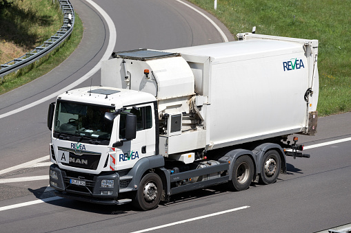 Wiehl, Germany - June 25, 2019: REVEA MAN dustcart on motorway