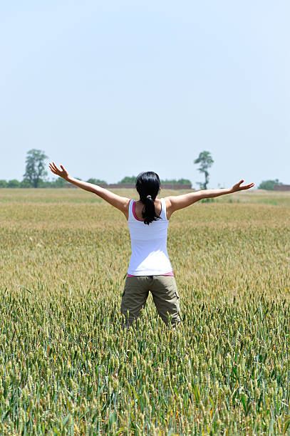 istock woman happy wheat field 178748234
