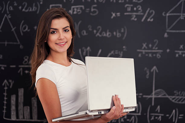 istock Female student with laptop in her hands 178748314