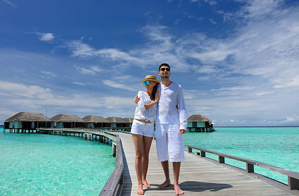 istock Couple on a beach jetty at Maldives 178749144
